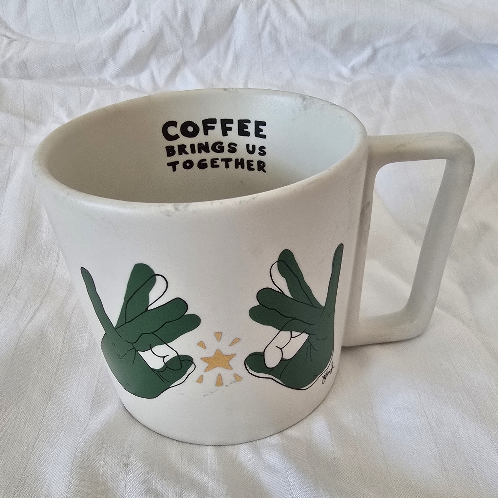 White Coffee Mug From Starbucks with Green Design